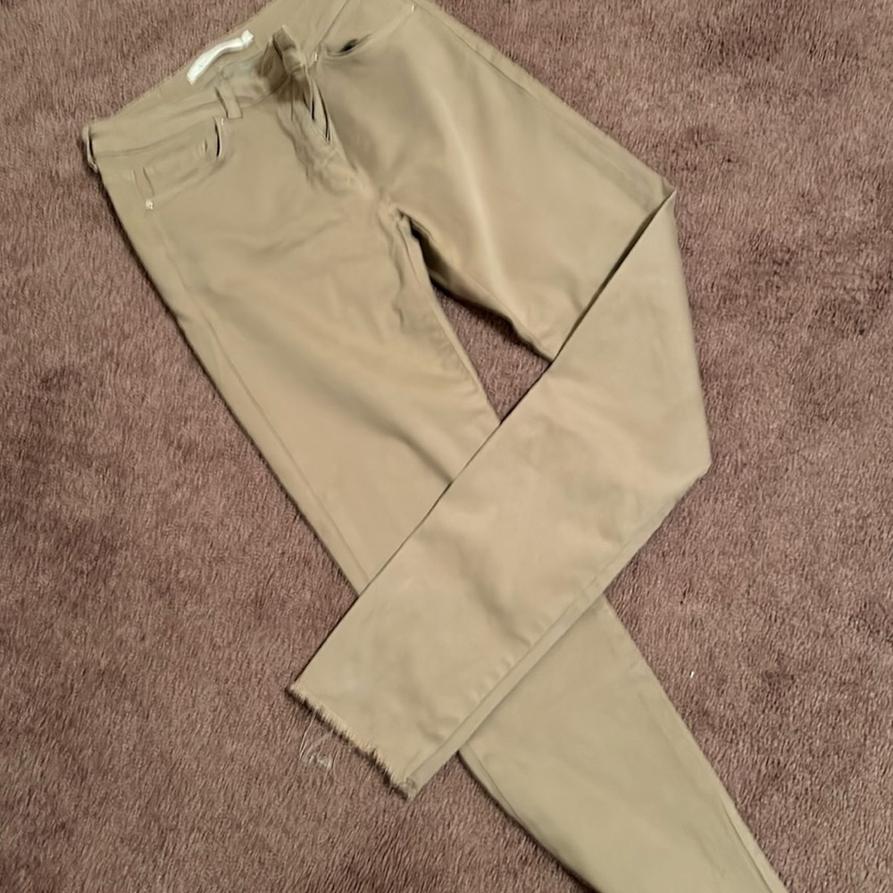 Khaki jeans with frayed bottom